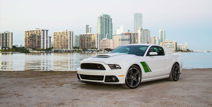 Roush Mustang in front of city and river